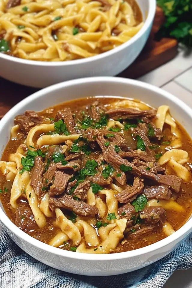 Warm up your evenings with this **Delicious Slow Cooker Beef and Noodles Recipe**! Perfect for a cozy dinner, this dish combines tender beef and savory noodles in a rich sauce, making it a family favorite. It’s easy to prepare and allows you to set it and forget it, freeing you up for other activities. Plus, it’s packed with flavor and comfort—ideal for any season. Don’t miss out on this hearty meal! Save this pin for your next cooking adventure or check out our website for more tasty pasta recipes!